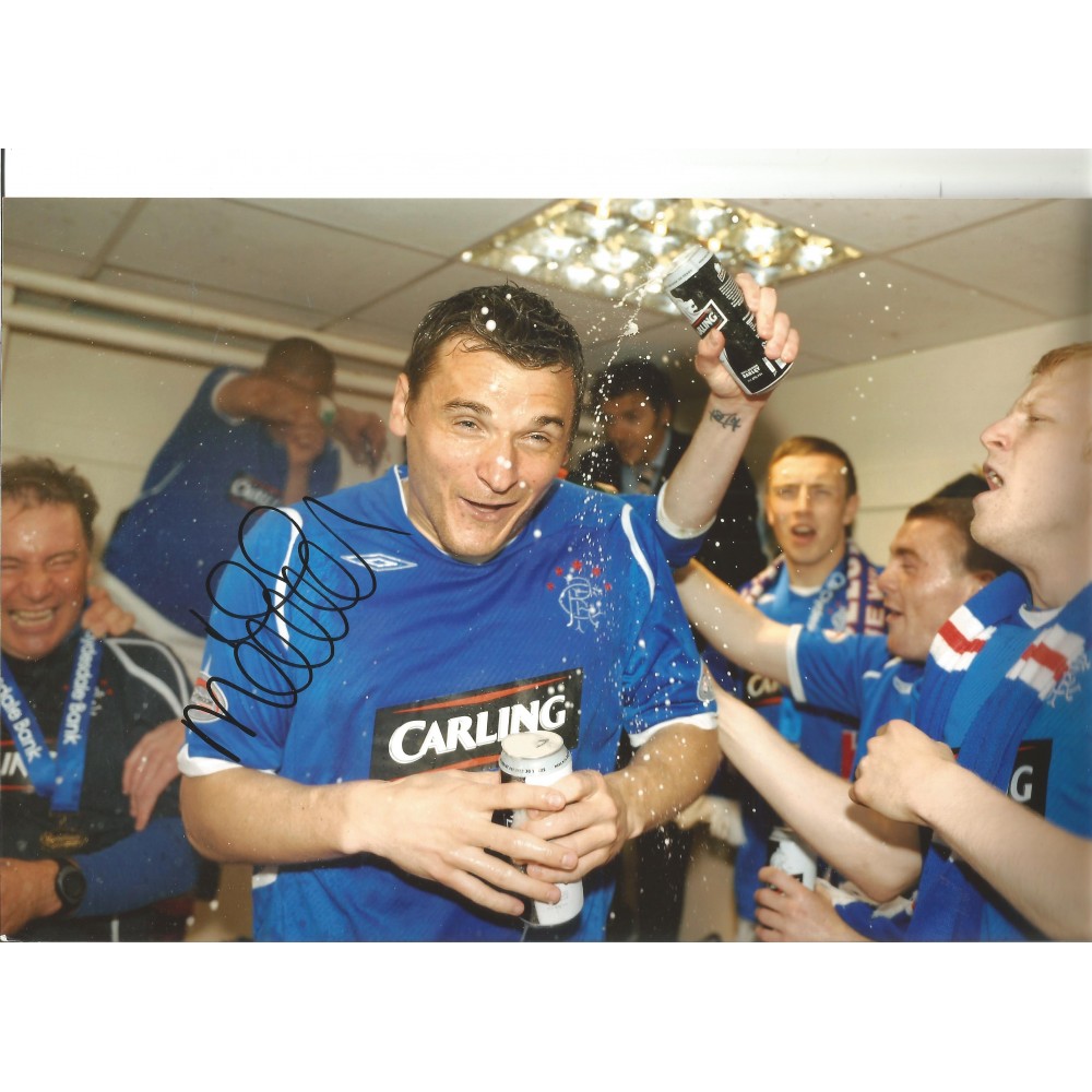 Lee MCCulloch Rangers Signed 8 x 12 inch football photo. Lee MCCulloch Rangers Signed 8 x 12 inch football photo.