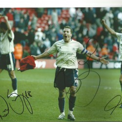 Multi Barnsley 12 x 8 colour photo signed by Howard, Da Silva & Souza. Multi Barnsley 12 x 8 colour photo signed by Howard, Da Silva & Souza.